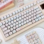 A playful collection of Dreamy Girl's Worries Series Keycap Set for custom keyboards, showcasing their aesthetic from various angles, perfect for personalized design.