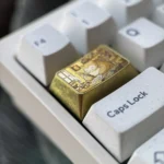 Golden Snorlax Titanium Keycap collectible, showcasing its iconic golden design and lustrous finish from multiple angles, a playful Pokemon charm.