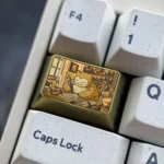 Explore the Golden Snorlax Titanium Keycap collectible from various angles, highlighting its iconic golden design, lustrous finish, and playful Pokemon art.