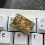 Golden Snorlax titanium keycap showcased from multiple angles, revealing its lustrous golden finish, iconic design, and collectible Pokemon charm.