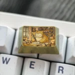 Golden Snorlax Titanium Keycap collectible, featuring an iconic golden Snorlax design and lustrous titanium finish. A must-have Pokemon charm.