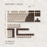 Close-up of the Good Night Cocoa PBT+PC backlit keycap set, showcasing its warm, translucent cocoa hues and soft glow, perfect for cozy evening typing.