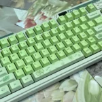 Greenery PBT Keycaps Set. Multiple views emphasize lush, nature-inspired design, durable PBT, and Cherry profile for a tranquil aesthetic.