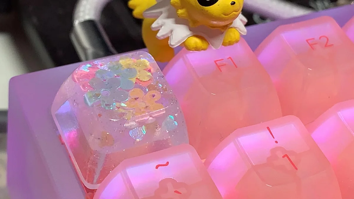 Multiple angles of a handcrafted luminous floral artisan keycap, showcasing vibrant encapsulated flowers within translucent resin for an ethereal design.