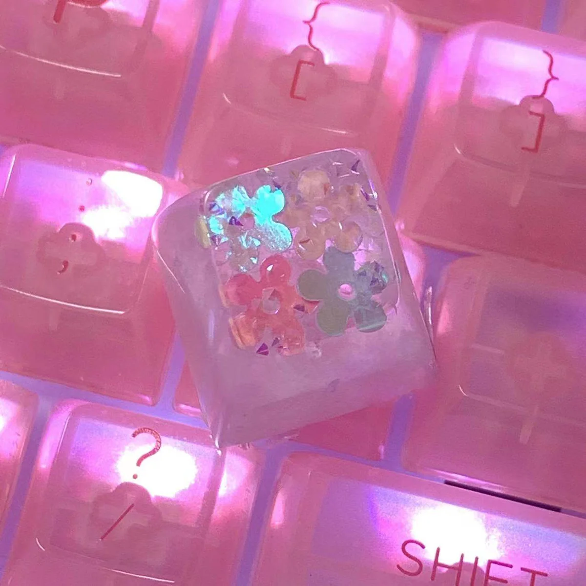 Handcrafted luminous floral keycap, a unique artisan ESC piece with vibrant encapsulated flowers set in translucent resin, creating an ethereal desktop.