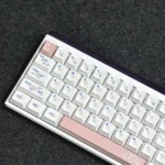 Gallery views of the Exclusive Heartbeat Cherry Keycap Set, highlighting durable dye-sub PBT and crisp front-printed legends. Vibrant aesthetic, magnetic switch compatible.