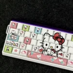 A gallery showcasing vibrant Hello Kitty Side-Printed Backlit PBT Keycaps Set from multiple angles, highlighting iconic designs and playful illumination.