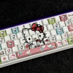 Hello Kitty side-printed backlit PBT keycaps set. Various angles reveal charming Hello Kitty motifs and vibrant legends for a playful illuminated look.