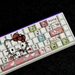 A playful gallery of Hello Kitty side-printed backlit PBT keycaps set, showcasing the iconic characters and vibrant illumination from various angles.