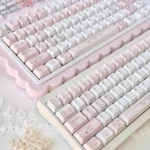Charming Hello Kitty keycaps set displayed from various angles, highlighting the vibrant fashion blog design and complete set.
