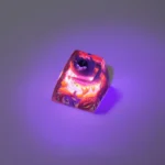 Handcrafted translucent Hollow Knight Troupe Master Grimm luminous keycap, vividly showcasing its intricate dark fantasy art and vibrant glowing effect.