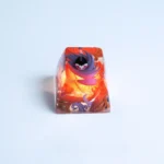 Handcrafted translucent Hollow Knight Troupe Master Grimm luminous keycap, showcasing intricate dark fantasy details and vibrant glowing art from various angles.