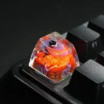 Handcrafted translucent Hollow Knight Troupe Master Grimm keycap, glowing with vibrant dark fantasy art and intricate detail, enhancing any gaming aesthetics.