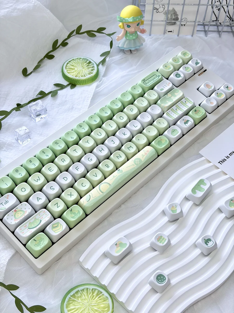 Premium Honeydew Ice Cream MOA Keycap Set. Multiple views show playful pastel keycaps, creamy melon and vanilla tones, for a sweet, dessert-inspired typing.