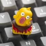 Whimsical Hotpot Duck artisan keycap, a unique handcrafted resin art piece for ESC, shown from a different angle, highlighting vibrant colors and cutie design.