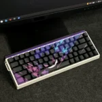 Close-up of a mischievous Gengar backlit artisan keycap set, showcasing its intricate sculpted details and vibrant glowing purple charm from various angles.