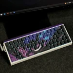 Detailed view of the Gengar backlit artisan keycap set, highlighting its sculpted form and vibrant purple glow. A mischievous pop culture icon.