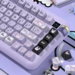 A vibrant close-up of the mischievous Kuromi PBT MDA keycaps set, showcasing their iconic black and purple design and premium quality from a different angles.