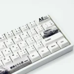 Initial D PBT Dye-Sub AE86 Keycaps Set gallery view, showcasing iconic JDM racing designs and vibrant anime art from multiple angles, perfect for reliving stress.