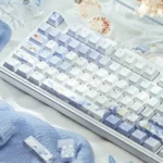 Artistic product views of JX3 Penglai Keycaps Set, revealing their exclusive mystical ocean realm design. Ethereal blue hues and traditional Chinese fantasy.