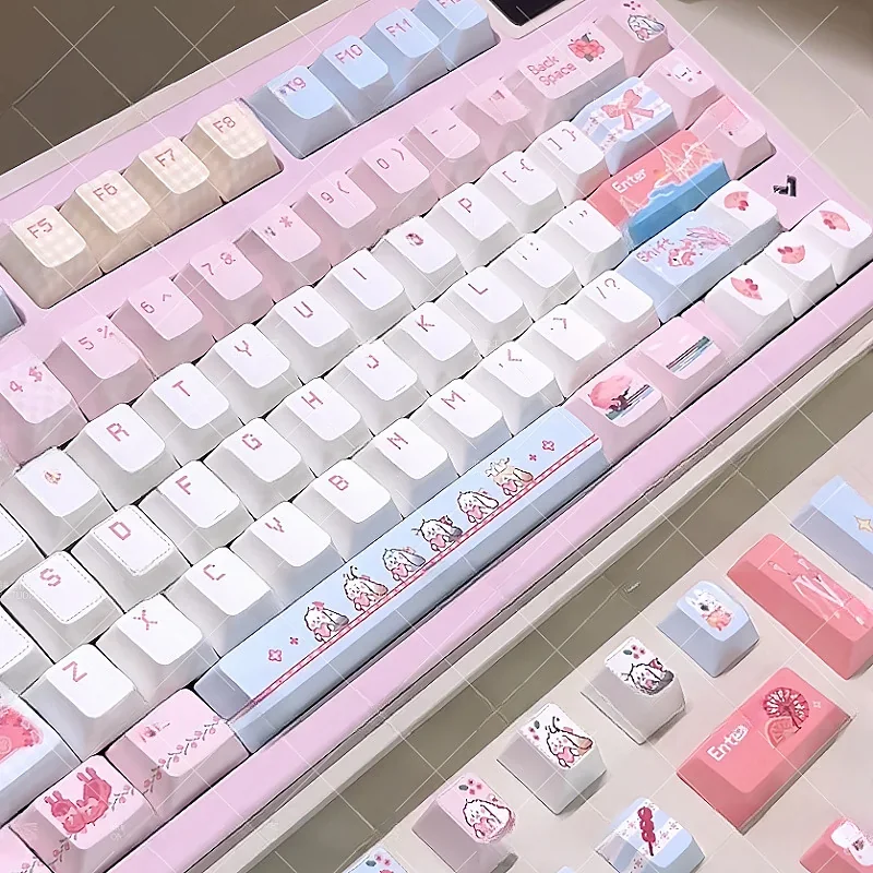 Artistic JX3 Qi Xiu pixel keycaps set displayed from various angles, highlighting exclusive JX Online 3 elegant clan designs and charming pixel aesthetics.