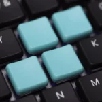 A collection of vibrant PBT Kailh Choc V1 low-shaft keycaps, meticulously displayed from multiple angles, showcasing their clean, minimalist design.