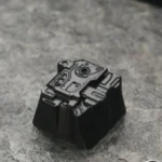 Premium sci-fi keycap, MOSS Wandering Earth artisan, crafted from zinc-aluminum alloy, showcasing its distressed futuristic design from multiple angles.