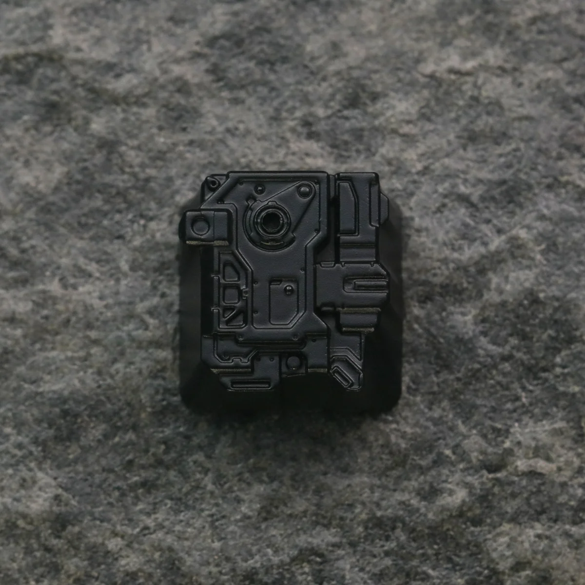 Premium zinc-aluminum alloy sci-fi keycap, showcasing its distressed artisan design and futuristic space aesthetic.