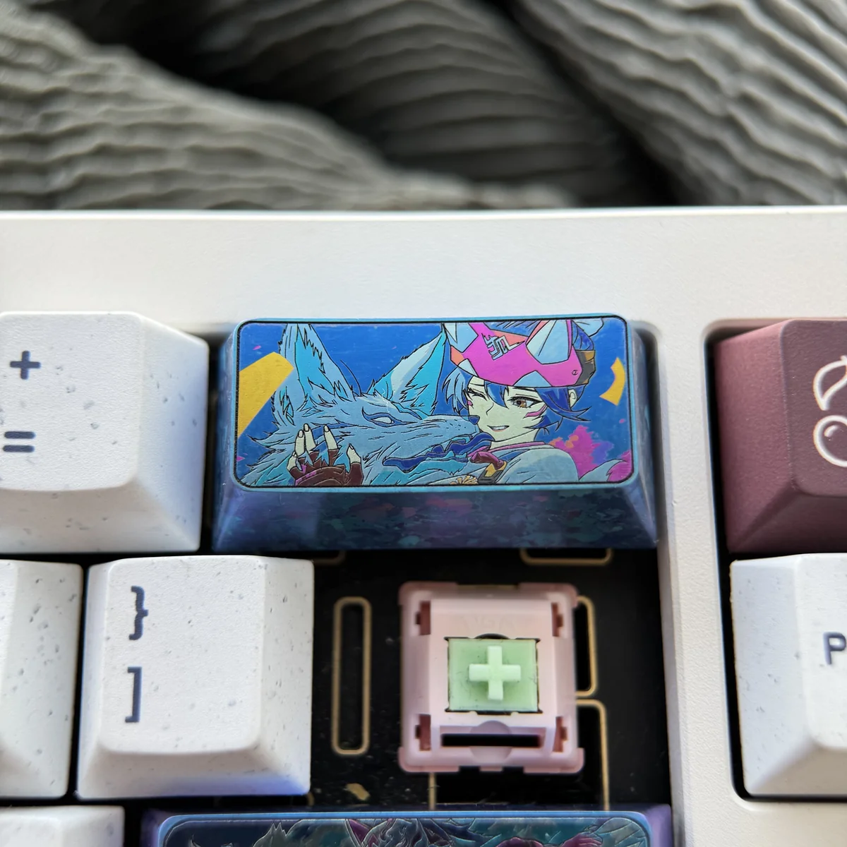 A premium Kiriko Titanium Overwatch keycap from a new angle, revealing its sleek metallic finish and detailed Japanese design, perfect for gamers.