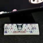 Kuromi Side-Engraved Backlit Keycaps Set: Dark-cute translucent designs, distinct side-engraved legends, vibrant RGB, multiple views.