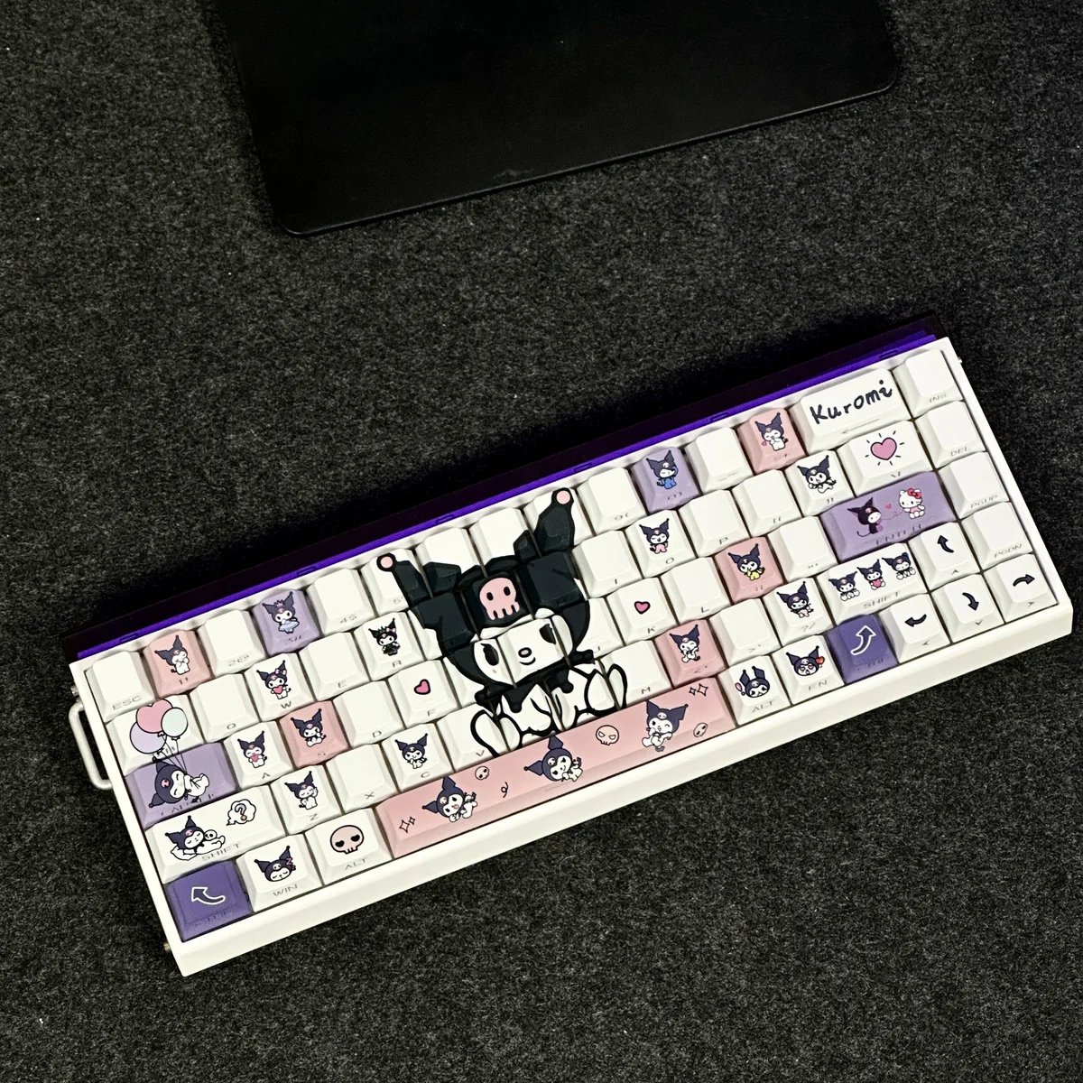 Gallery of exclusive Kuromi side-engraved backlit keycaps set, highlighting their translucent dark-cute design and vibrant RGB glow from multiple angles.