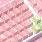 Artistic Lily of the Valley PBT keycaps set from a new angle, showcasing delicate purple, pink, and green dye-sub floral patterns on a pristine background.