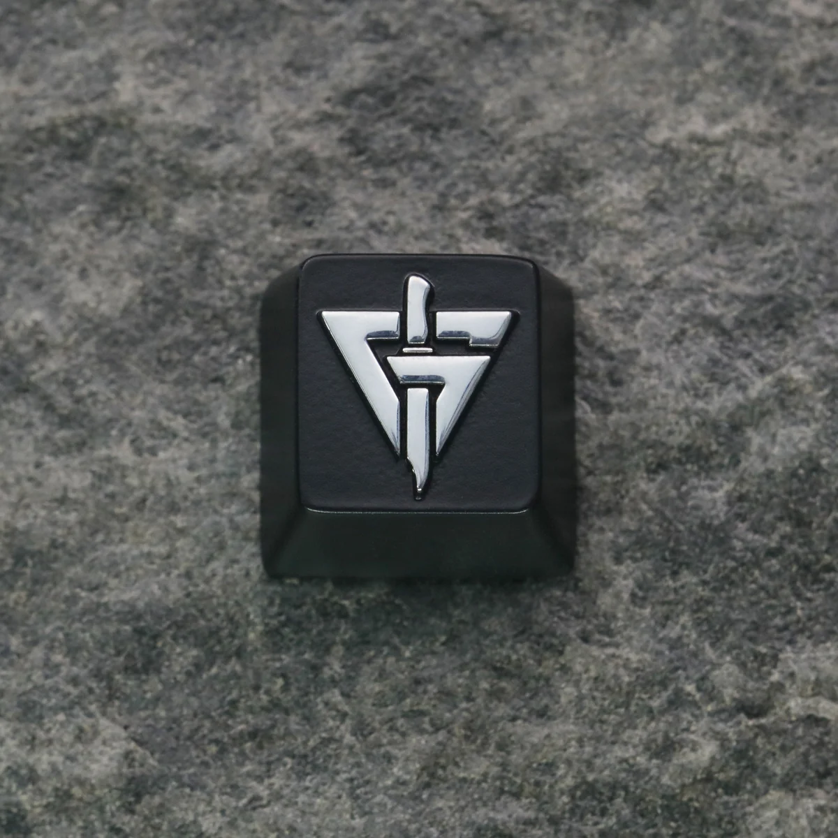 Delta Force: GTI Logo Keycap showcasing its sleek metallic finish and iconic logo, perfect for enthusiasts.