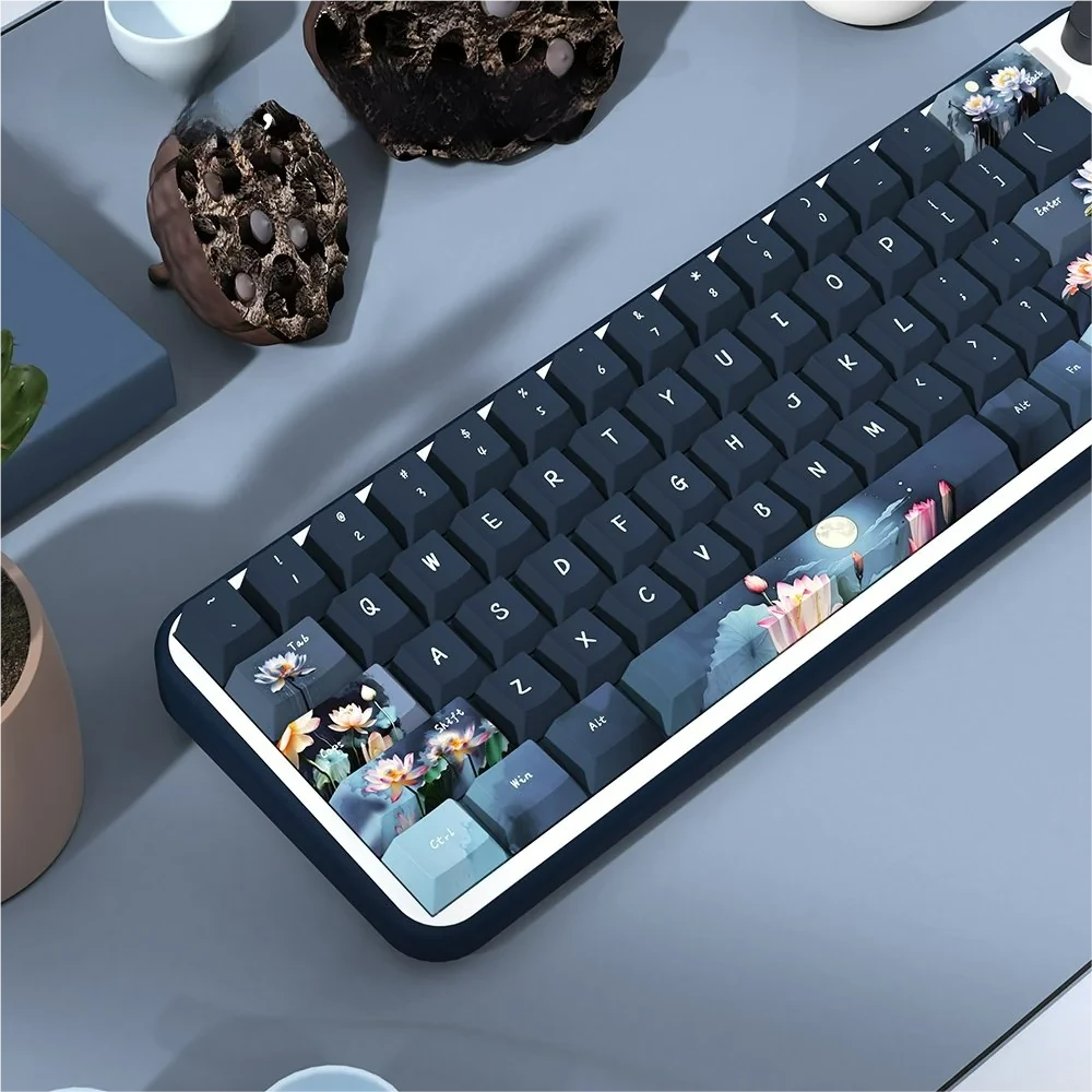 Artistic PBT Dye-Sub Moonlit Lotus Pond Keycaps set, displaying a tranquil moonlit lotus and delicate flower design on PBT from a unique, detailed view.