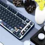 Artistic PBT dye-sub Moonlit Lotus Pond Keycaps Set, shown from various angles, detailing delicate flowers and tranquil water with traditional Chinese design.