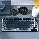 Artistic PBT Dye-Sub Moonlit Lotus Pond Keycaps Set. Serene moonlit pond with delicate flowers, tranquil water, embodying calming traditional Chinese aesthetics.