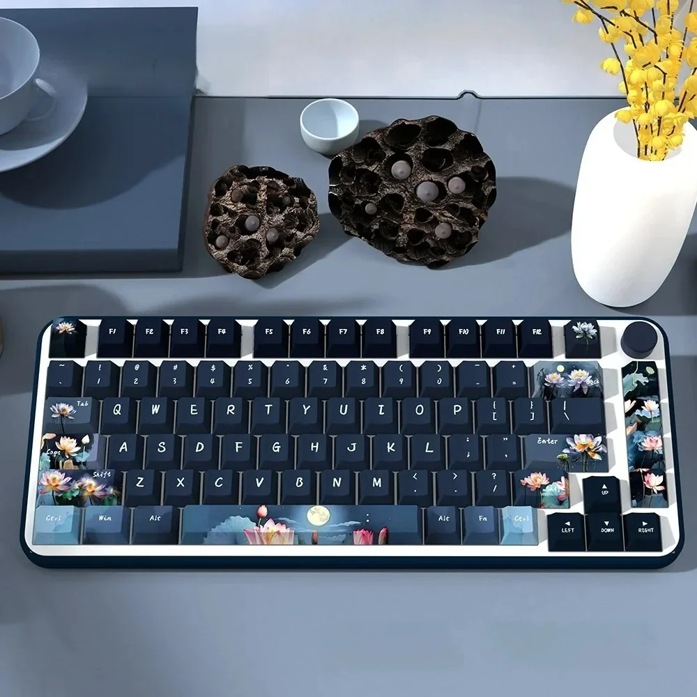 Artistic PBT Dye-Sub Moonlit Lotus Pond Keycaps Set. Serene moonlit pond with delicate flowers, tranquil water, embodying calming traditional Chinese aesthetics.