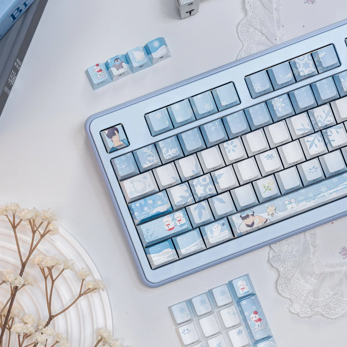 Close-up of the exclusive Love Deepspace Zayne Winter keycaps set, showcasing intricate icy blue and white designs from a unique angle, embodying Zayne design.