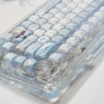 An exclusive Love Deepspace Zayne Winter keycaps set, captured from various angles to highlight its serene icy blue and white aesthetic.