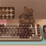 Gallery of charming Lucky Bear PBT gradient keycaps set, showcasing adorable brown hues and whimsical bear motif from multiple angles for a cozy, playful setup.