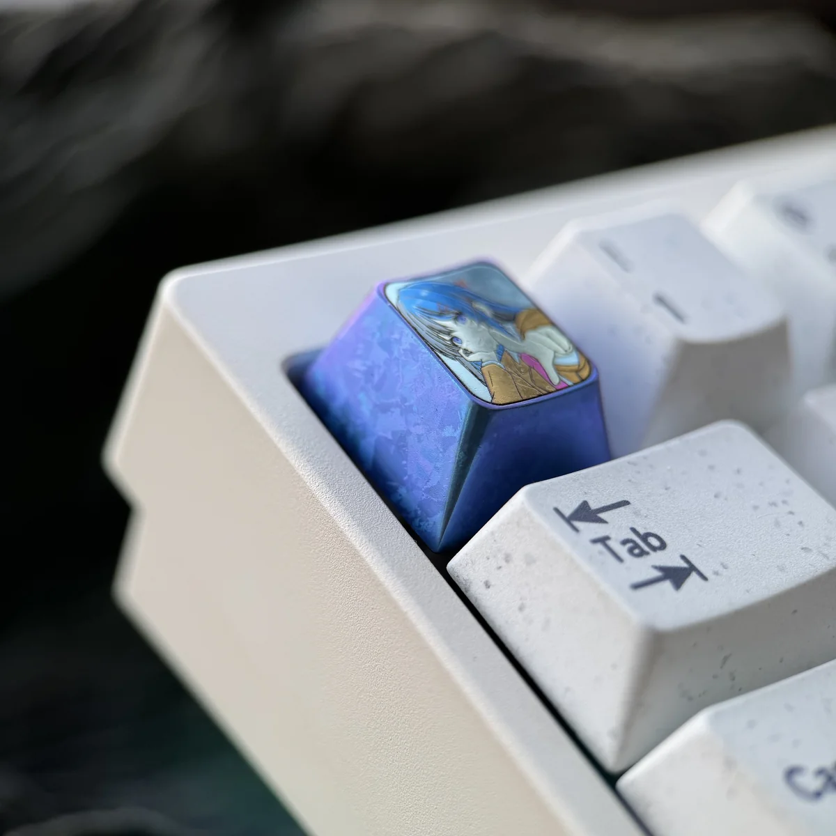 Angled view of the premium Mai Sakurajima titanium ESC keycap, showcasing its elegant sculpted anime art and brilliant metallic finish.