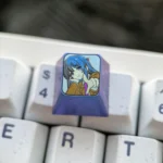 Close-up of the premium Mai Sakurajima Titanium ESC keycap, showcasing its elegant sculpted anime art and metallic luster from a distinct angle.