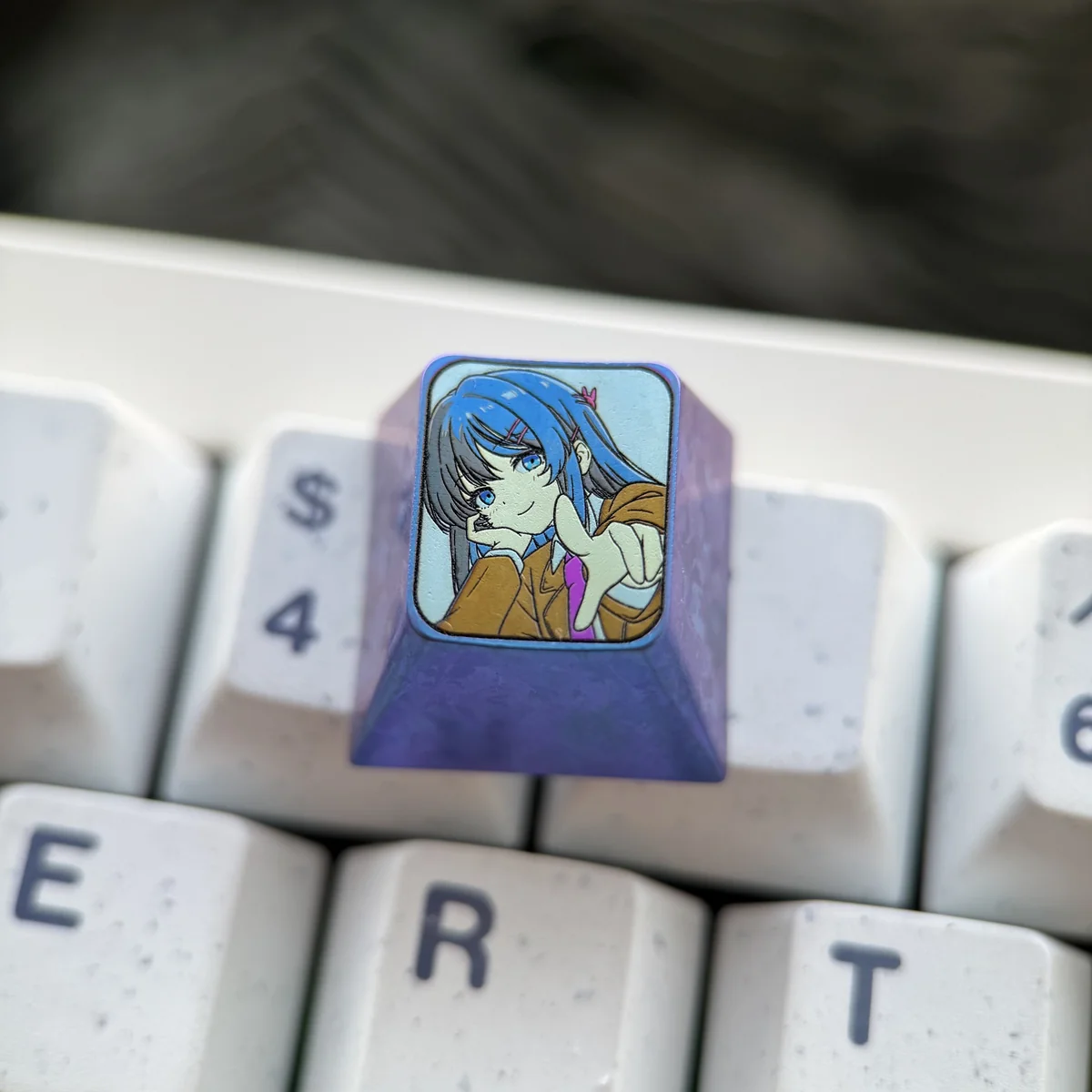 Close-up of the premium Mai Sakurajima Titanium ESC keycap, showcasing its elegant sculpted anime art and metallic luster from a distinct angle.