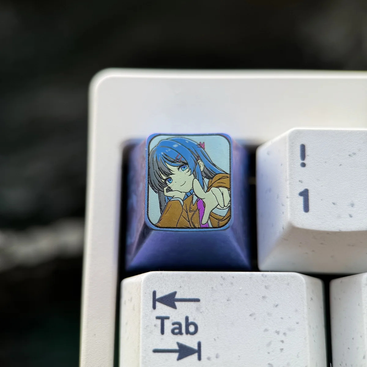 Elegant Mai Sakurajima titanium ESC keycap, a premium anime art collectible. Features sculpted detail, metallic luster, and high-quality craftsmanship.
