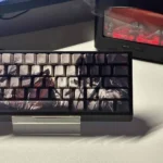 Exquisite Man Jiang Hong PBT dye-sub keycaps set featuring deep red hues, traditional Chinese calligraphy, and elegant side-engraved legends.