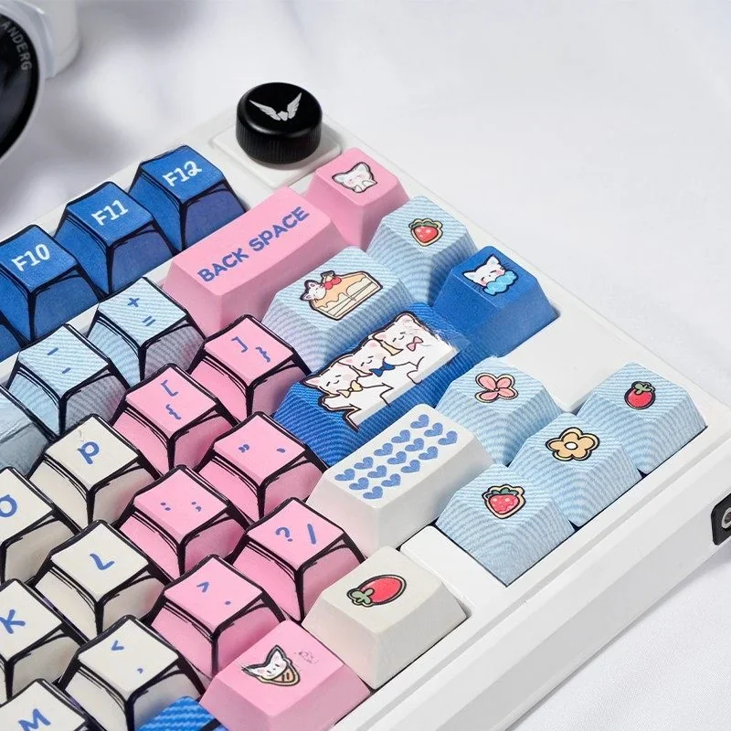 A playful side view of the adorable manga kitten PBT keycaps set, highlighting their vibrant, charming designs for a cute desk aesthetic.
