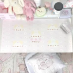 Detailed view of the whimsical extra-large marshmallow cat desk mat in soft pink, showcasing its cute design and dreamy aesthetic on a modern desk.