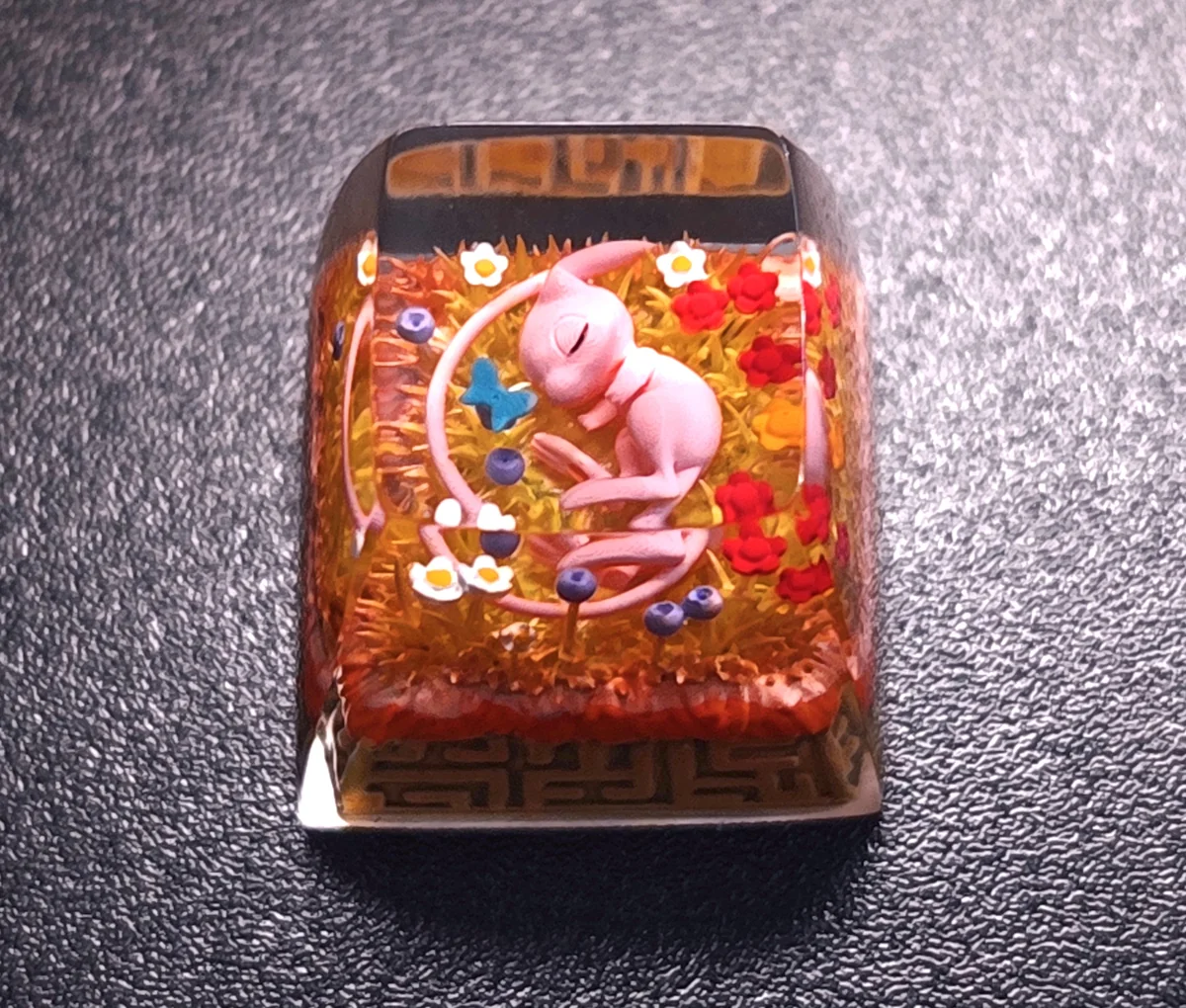 An exquisite artisan Mew keycap, captured in a detailed close-up, revealing its ethereal pastel hues and mystical Pokemon charm.