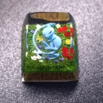 Legendary Mew keycap in exquisite artisan detail, displaying its mystical pastel hues and iconic Pokemon charm from multiple artistic angles.