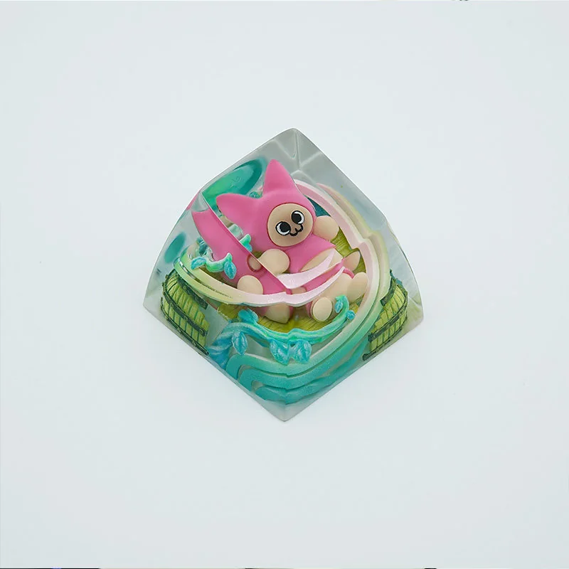 Close-up of the handcrafted Monster Hunter Palico keycap, revealing its charming, intricately sculpted details and vibrant colors from a unique angle.